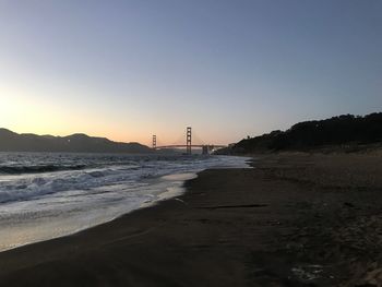 View of beach against sky during sunset