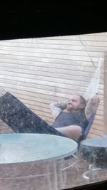 High angle view of man relaxing in swimming pool