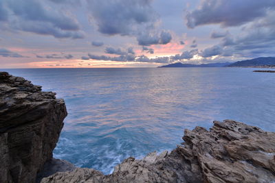 Scenic view of sea against sky at sunset