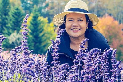 Portrait of happy woman with flowers