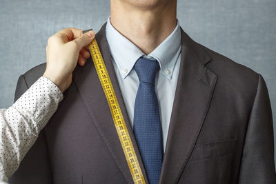 Midsection of man wearing mask