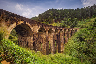 Arch bridge against sky