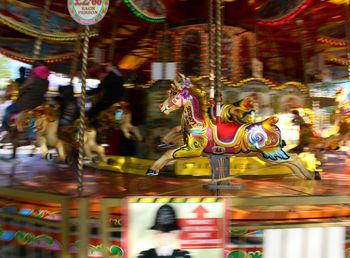 Close-up of illuminated carousel in amusement park