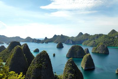 Panoramic view of rocks on sea against sky