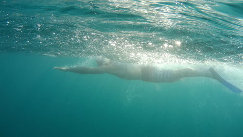 Swimming underwater in sea