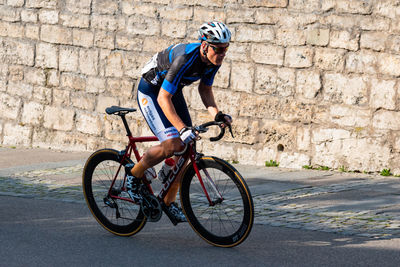 Man riding bicycle on street