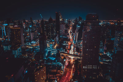 High angle view of illuminated city buildings at night