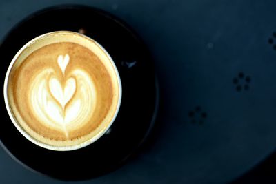 Close-up of cappuccino on table