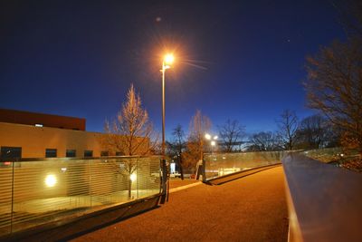 View of illuminated street at night