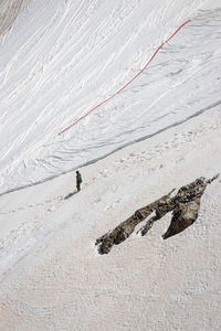 High angle view of people on snow covered land