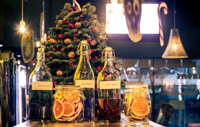 Drink bottles on table at restaurant during christmas