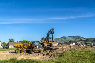 Construction site on field against sky