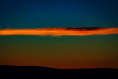 Scenic view of dramatic sky at sunset