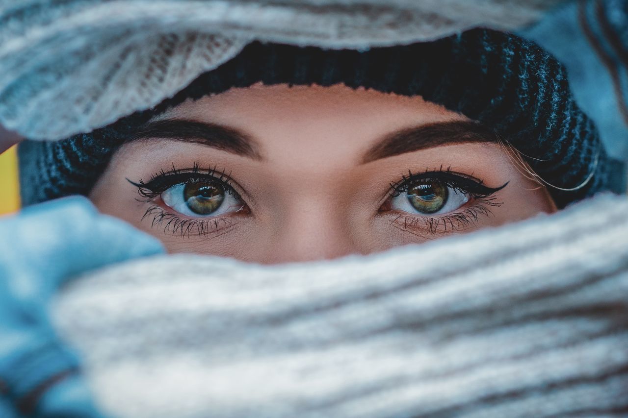 one person, portrait, looking at camera, young adult, real people, body part, clothing, young women, human body part, lifestyles, selective focus, leisure activity, close-up, headshot, women, human face, eye, covering, scarf, warm clothing, beautiful woman, eyebrow, hood - clothing