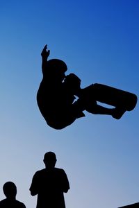 Low angle view of statue against blue sky