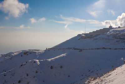 Scenic view of snowcapped mountain against sky