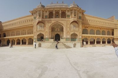 Group of people in front of historical building