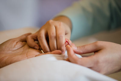 Close-up of nurse taking blood sugar test of patient