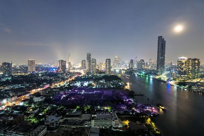 High angle view of illuminated buildings in city at night