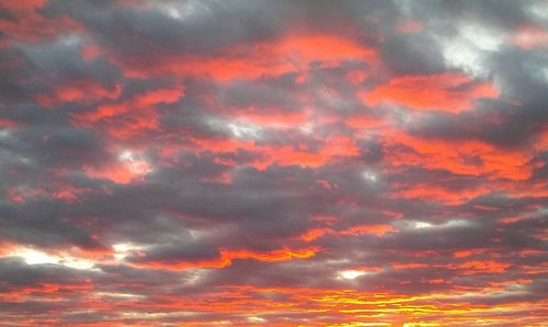 Low angle view of dramatic sky during sunset