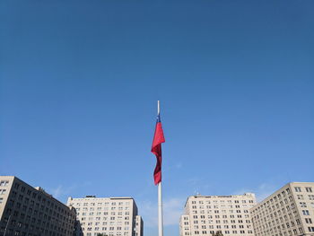 Low angle view of buildings against blue sky