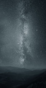 Scenic view of star field against sky at night