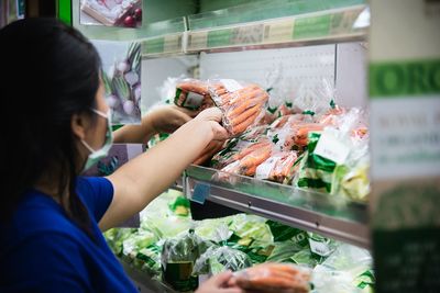 Midsection of woman at market stall