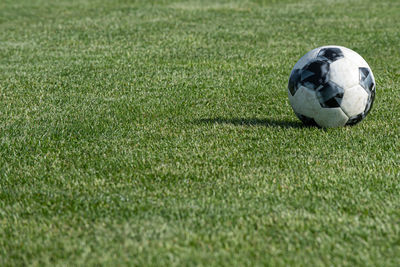 Close-up of soccer ball on field