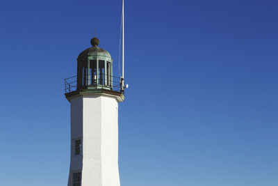 Lighthouse against clear blue sky