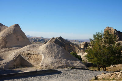 Scenic view of mountains against clear blue sky