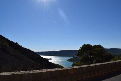 Scenic view of mountains against clear blue sky