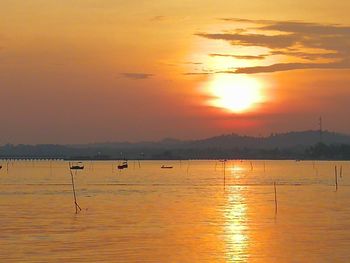 Scenic view of sea against orange sky