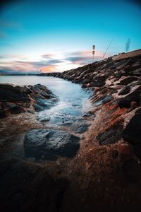 Scenic view of sea against sky at sunset