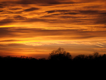 Scenic view of dramatic sky during sunset