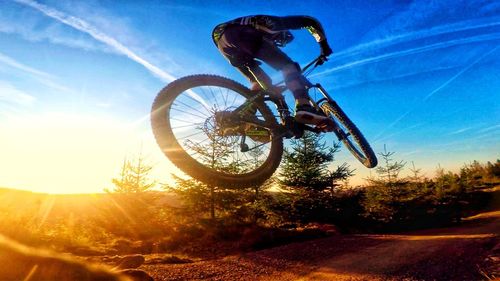 Low angle view of bicycle on road against sky