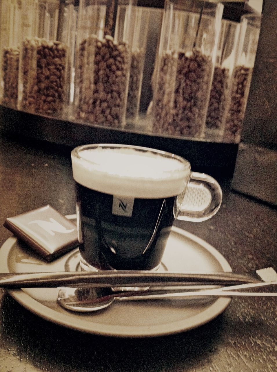 indoors, table, still life, coffee cup, close-up, food and drink, drink, high angle view, coffee - drink, no people, refreshment, cup, saucer, focus on foreground, coffee, empty, wood - material, selective focus, chair, absence