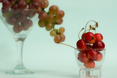 Close-up of red berries on glass table
