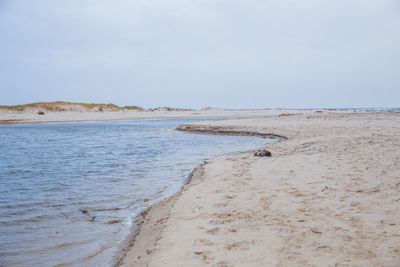 Scenic view of beach against clear sky