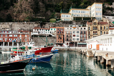 Boats moored at quay in spain