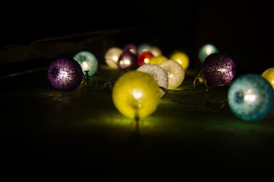 Close-up of illuminated lights on table