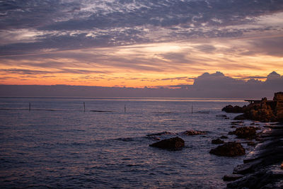 Scenic view of sea against sky during sunset