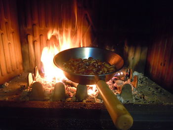 Close-up of burning candles on barbecue grill