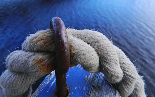 Close-up of rope tied on pier