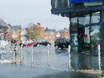 View of wet street during rainy season
