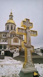 Traditional building against sky during winter