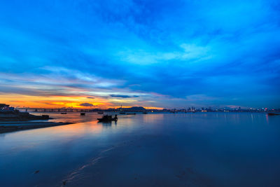 Scenic view of sea against sky at sunset