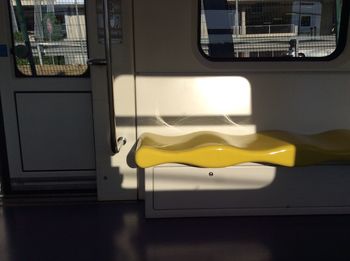 Empty yellow seat in train