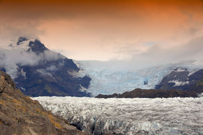 Scenic view of glacier against sky