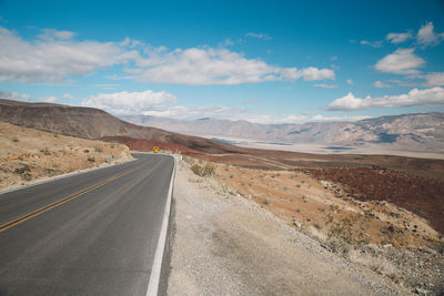 View of road on desert against sky