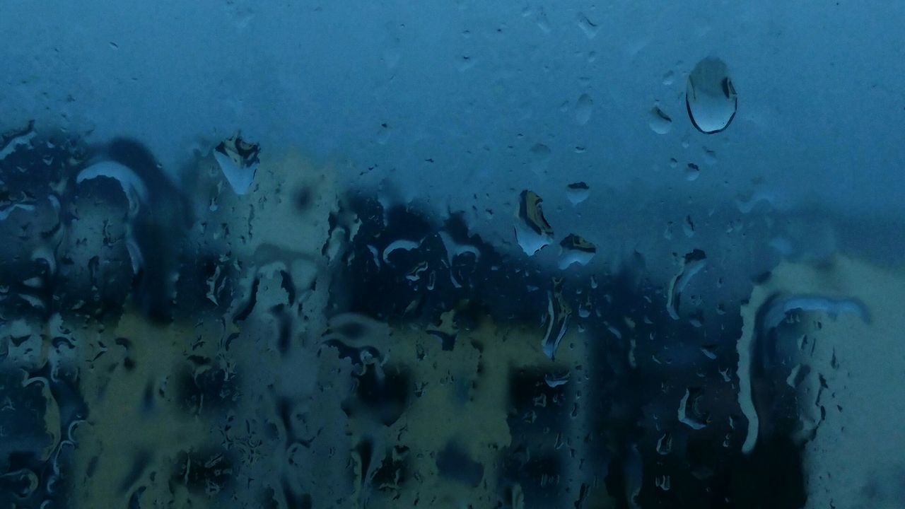 FULL FRAME SHOT OF WATER DROPS ON GLASS